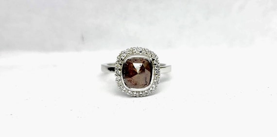 Chocolate color rose cut cushion diamond engagement ring with halo.