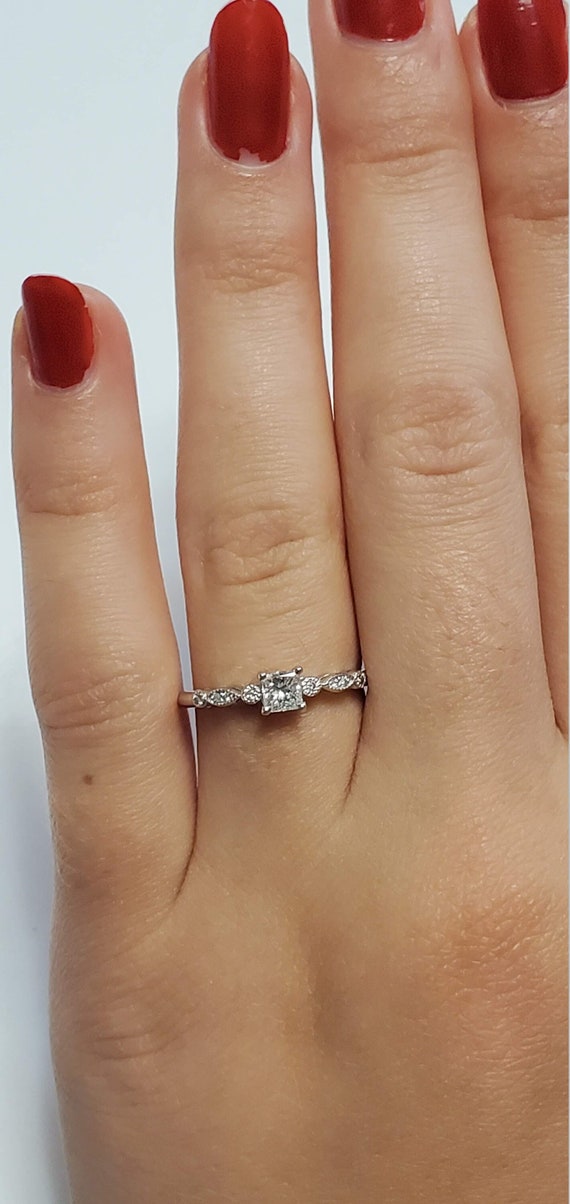 Vintage Princess cut diamond engagement ring.