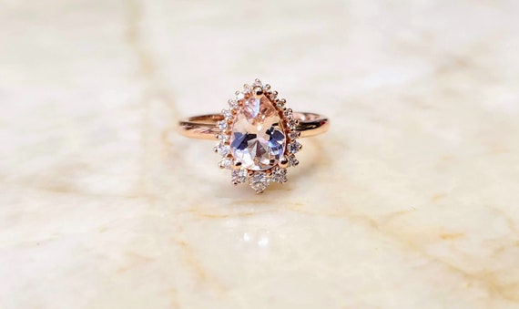 Morganite with Diamond halo Ring.