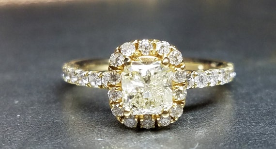 Cushion cut diamond engagement ring yellow gold.