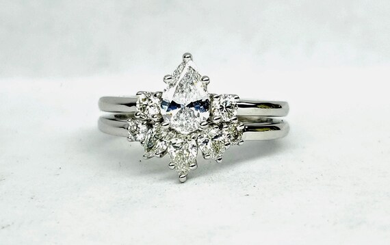 Pear shape diamond engagement and wedding set in 14kt white gold. Bridal set