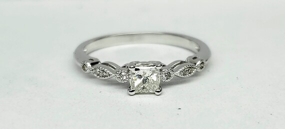 Vintage Princess cut diamond engagement ring.