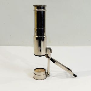 Vintage folding chrome metal pocket microscope — antique tabletop optical loupe, collectible scientific instrument