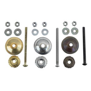 May include: Three sets of cabinet knobs with different finishes: gold, silver, and bronze. Each set includes a knob, screw, washer, and nut.