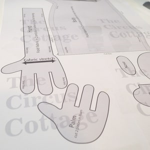 Hand puppet pdf pattern on top pf a table.