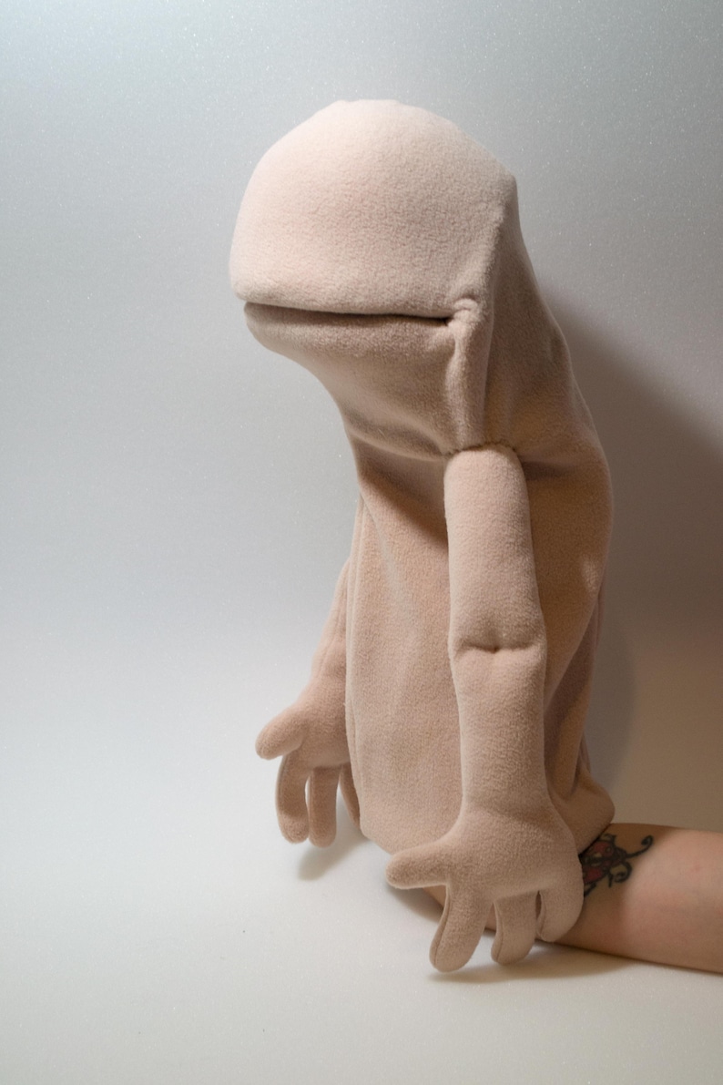 A hand puppet  made from foam and fleece ,made using a digital download puppet pattern.