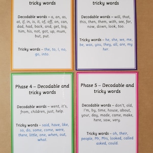 May include: Four flashcards with text for educational use. Each card has a different colored border: orange, purple, green, and pink. The cards display "Decodable and tricky words" with lists of words for phases 2, 3, 4, and 5.