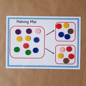 May include: A learning aid labelled "Halving Mat" with a blue border. The mat shows colourful circular counters in red, yellow, green, blue, purple, pink, and brown, demonstrating the concept of halving. The counters are arranged in groups.