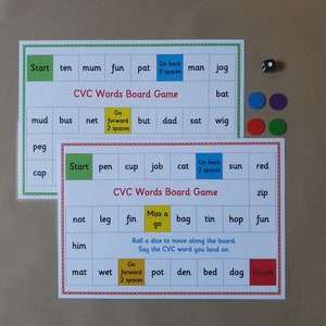 May include: Two CVC Words board games with colourful squares and words, a die, and coloured game pieces. The games have instructions and are designed for educational purposes.