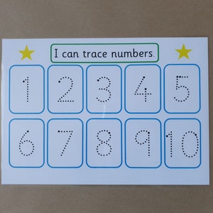 May include: A white educational card with blue borders, featuring numbers 1-10 in dotted lines for tracing. The text "I can trace numbers" is above the numbers, with yellow stars on each side. Educational material for children.