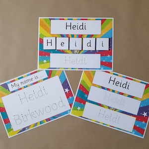 May include: Three educational name cards featuring the name "Heidi". The cards have a vibrant rainbow and star design. One card also displays the name "Heidi Birkwood".