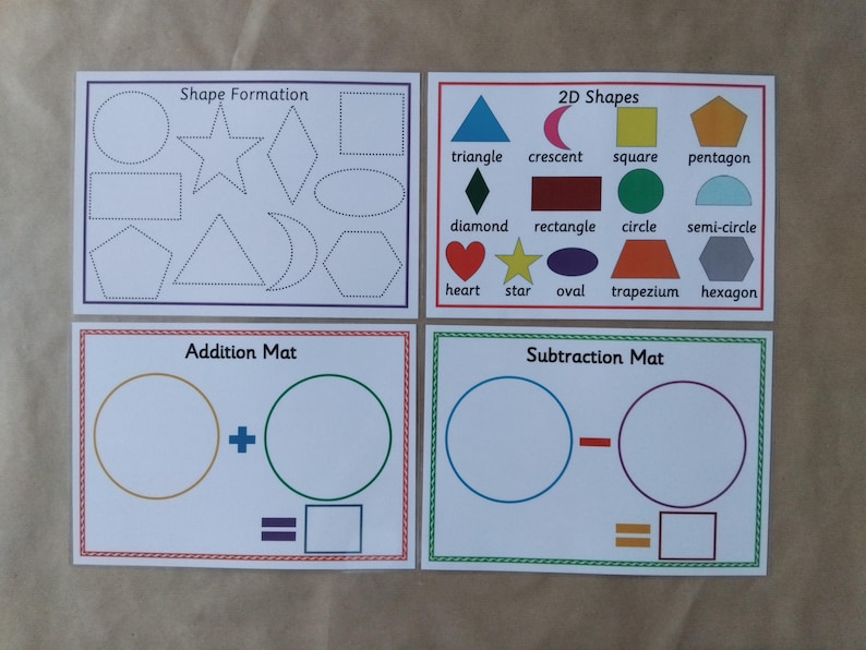 May include: Four educational cards with white backgrounds. The cards feature shapes, 2D shapes, addition, and subtraction. The "Shape Formation" card shows outlines of shapes. The "2D Shapes" card displays various shapes with labels. The "Addition Mat" and "Subtraction Mat" cards have circles and equations.