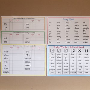 May include: A set of educational worksheets for reading and writing tricky words, including three sheets with tables and one roll and read game sheet. A small red six-sided die and a white dry-erase marker are included for interactive learning activities.