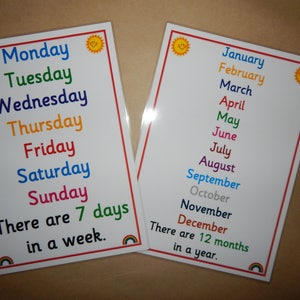 May include: Two educational posters with the days of the week and months of the year. The days are listed in a rainbow of colors, with a smiling sun graphic in the corners. The text "There are 7 days in a week" is included.