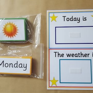 May include: Educational weather and day of the week learning set. Includes cards with a sun graphic and the word "Monday". A white board displays "Today is" and "The weather is" with space for cards.