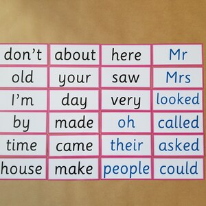 May include: A collection of flashcards with words in black and blue text, including "don't", "about", "here", "Mr", "old", "your", "saw", "Mrs", "I'm", "day", "very", "looked", "by", "made", "oh", "called", "time", "came", "their", "asked", "house", "make", "people", and "could".