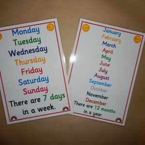May include: Two educational posters with white backgrounds. One lists the days of the week in rainbow colors, with the text "There are 7 days in a week." The other lists the months of the year, with the text "There are 12 months in a year."