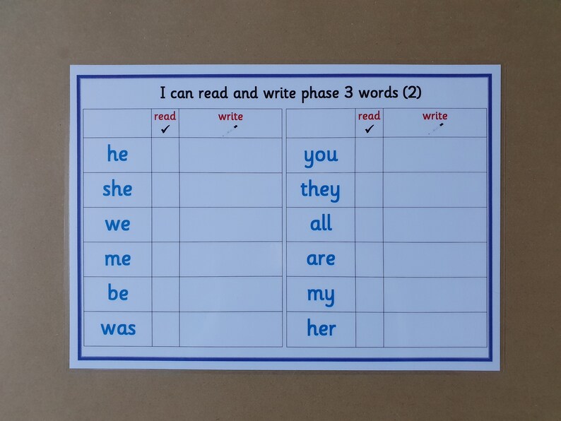 May include: A white educational chart with blue borders, featuring the text "I can read and write phase 3 words (2)". The chart is divided into columns for reading and writing, with words like "he", "she", and "you".