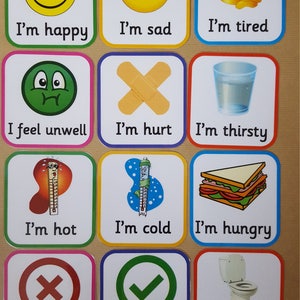 May include: A set of twelve square cards with rounded corners, each featuring a different emotion or need. The cards display images of a smiley face, a sad face, a sleeping face, a bandage, a glass of water, a sandwich, a thermometer, and a toilet. Text accompanies each image.