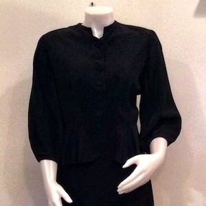 1940s vintage suit by Calbette peplum jacket interesting sleeve design black womens suit theater costume 1940s fashion suit