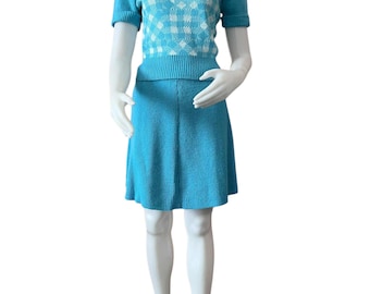 Vintage 1970s turquoise knit pullover sweater and skirt set by Heritage Knitwear size medium short sleeve turtleneck flippy skirt