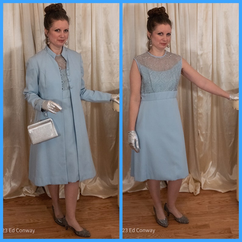 May include: A light blue dress with a sheer lace bodice and a matching jacket. The dress and jacket have a simple, elegant design. The model is wearing silver gloves and shoes.
