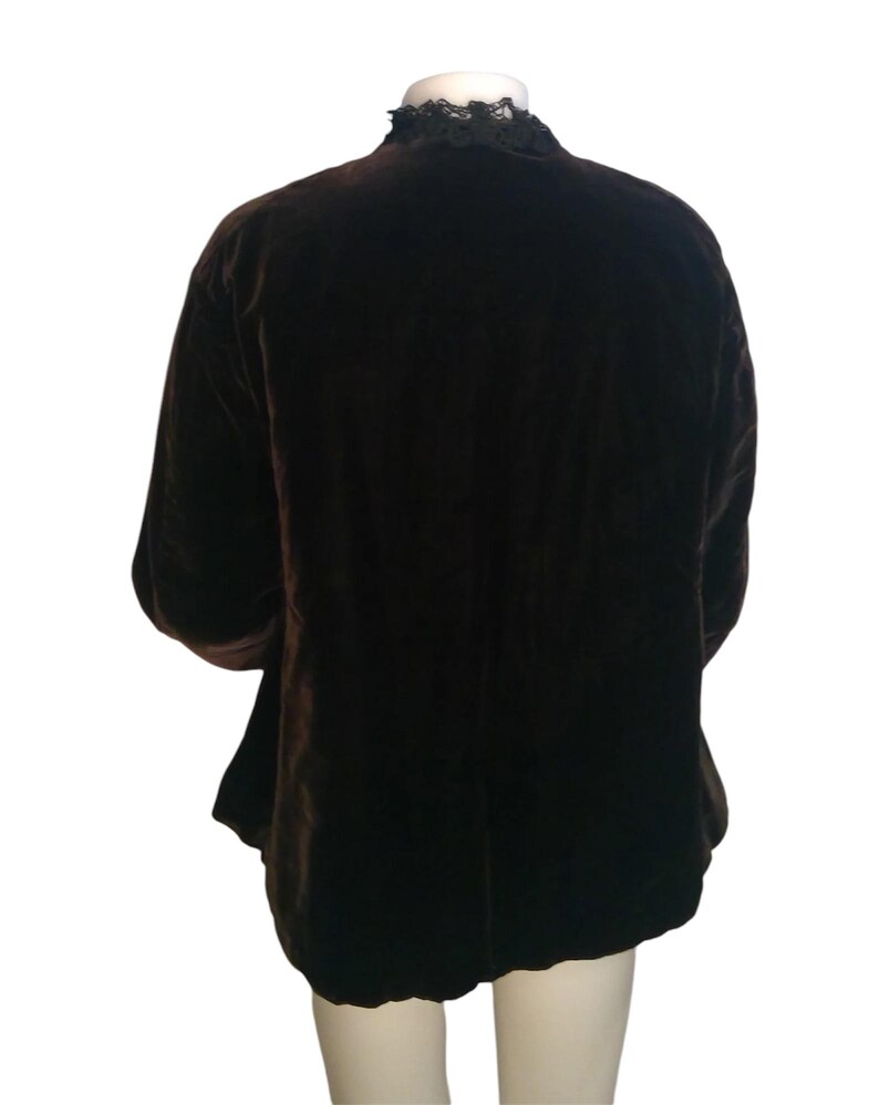 May include: A brown velvet jacket with a black lace collar.