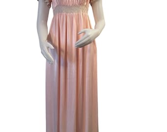 May include: A long, pink satin nightgown with a lace trim around the neckline and waist. The gown has short, ruffled sleeves.