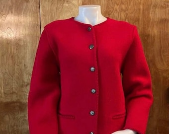 May include: A vibrant red jacket with a round neckline and long sleeves. The jacket features five decorative silver buttons down the front and two small pockets. The jacket is displayed on a white mannequin.