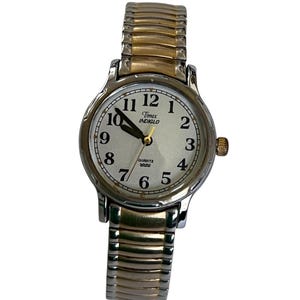 Vintage womens wrist watch TIMEX INDIGLO quartz water resistant expansion band 2 tone gold and silver round face