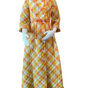 Vintage 1960s women’s bathrobe bright orange and yellow quilted ruffle trim cord belt button front 1960s hostess robe