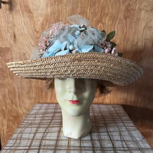 Vintage woven straw rattan hat with brim blue and pink flowers and ribbon People’s Republic of China beach garden party horse races