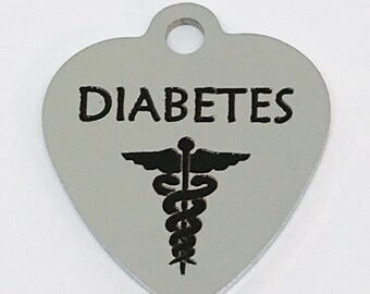 May include: Silver heart-shaped medical alert tag with the word "DIABETES" and a caduceus symbol.