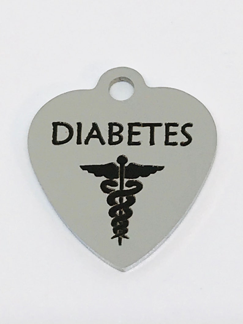 May include: Silver heart-shaped medical alert tag with the word "DIABETES" and a caduceus symbol.