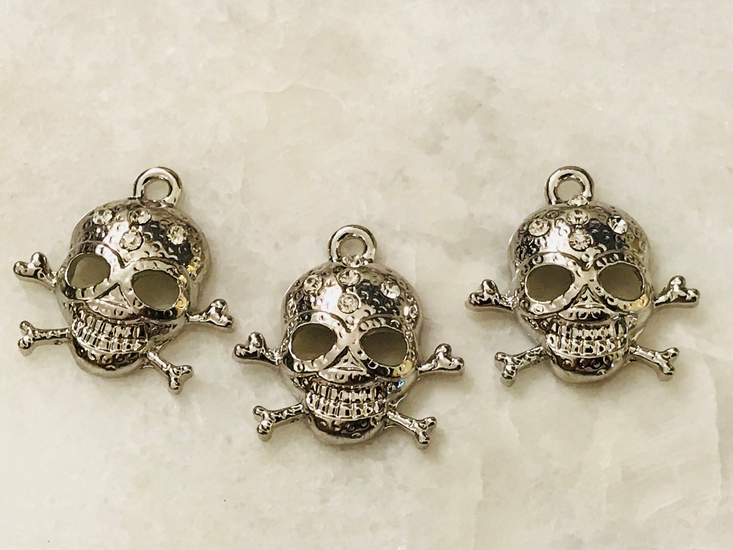 3 shiny silver and rhinestone skull charms hammered design | Etsy