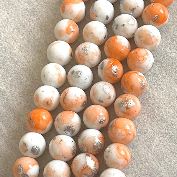10mm light orange and white glass beads - silver foil design
