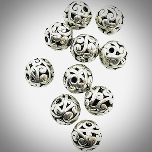 Set of 10 antique silver Tibetan style beads - filigree hollow design - round beads - approx 11mm