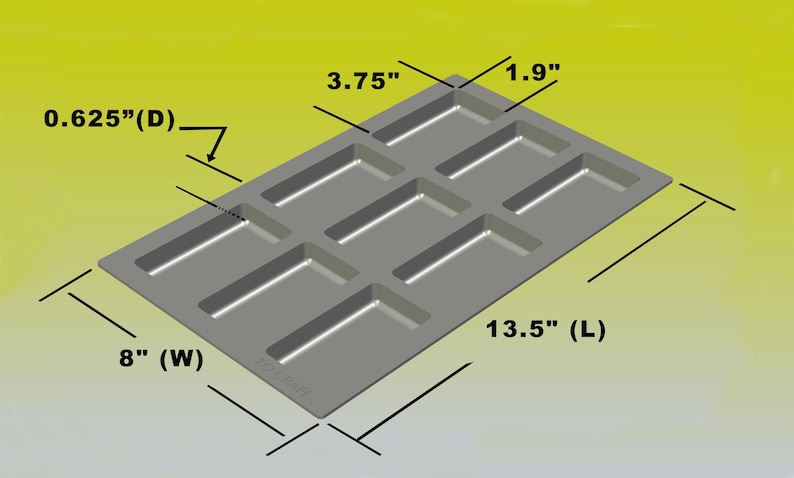Może przedstawiać: Szara prostokątna forma do pieczenia z ośmioma prostokątnymi wnękami. Forma ma 34,3 cm długości, 20,3 cm szerokości i 1,6 cm głębokości. Każda wnęka ma 9,5 cm długości i 4,8 cm szerokości.
