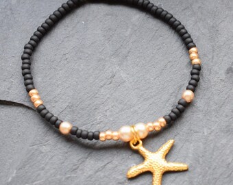 Nautical pearl bracelet, gold-colored starfish pendant, elastic arm jewelry