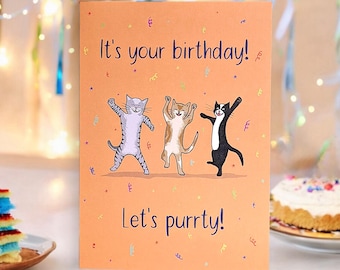 May include: A birthday card with an orange background featuring three cats dancing with confetti. The card reads "It's your birthday! Let's purrty!"