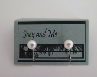 Clip on earrings for non-pierced ears. Freshwater cultured pearls and sterling silver