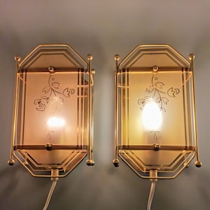 Pair of scandinavian vintage wall light sconces in brass and glass,marked Raf,made in Denmark 1970s