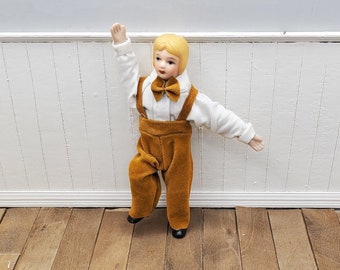 1/12 scale dollhouse miniature Victorian boy brother doll with porcelain hands, feet and head. Fully poseable doll for miniature scene.