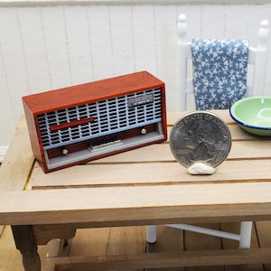 Dollhouse radio accessory. 1:12 scene supply radio with realistic details. Retro-look mid-century miniature faux Bakelite table radio.