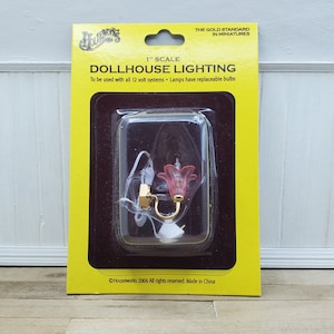 Dollhouse electric brass wall sconce with pink tulip shade 12v plug end. Damaged packaging. 1:12 scale light with pink frosted shade.