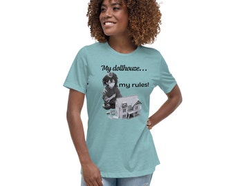 May include: A teal blue t-shirt with a black and white image of a girl playing with a dollhouse. The text on the shirt reads "My dollhouse... my rules!"