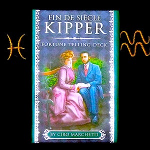 May include: A green and white box with the text "Fin de Siècle Kipper Fortune Telling Deck" and "By Ciro Marchetti". The box features an illustration of a couple sitting on a bench.
