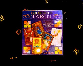 May include: A purple box with the title "Color Your Tarot" and a picture of tarot cards. The box is on a black background with gold zodiac symbols.