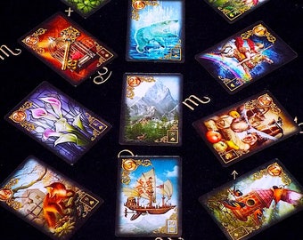 May include: A set of 10 playing cards featuring illustrations of various scenes and characters. The cards are decorated with gold trim and have a black background. The cards are numbered 3, 8, 9, 10, 12, 14, 15, 21, 23, and 30.