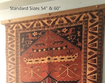 May include: A wooden tapestry hanger with a tapestry hanging from it. The tapestry is red, orange, and black with a geometric pattern. The hanger is labeled "Standard Sizes 54" & 60".